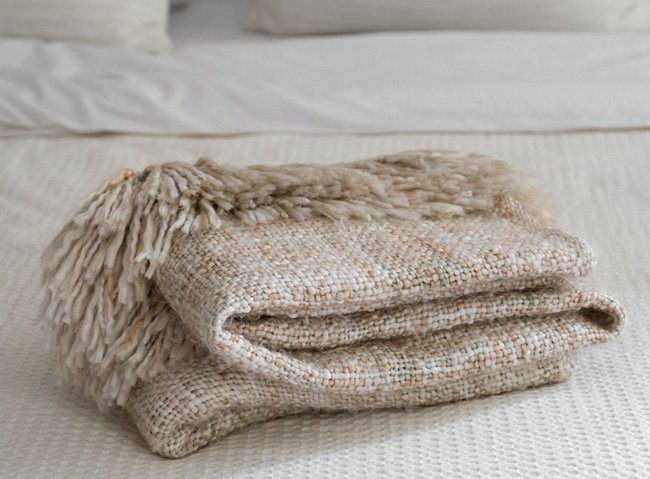 High quality Jacquard blankets on white bed